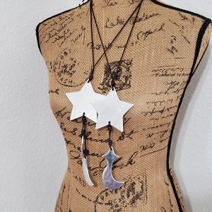 Silvertone and  goldtone matte metal Star twinkle and moon black cord necklace